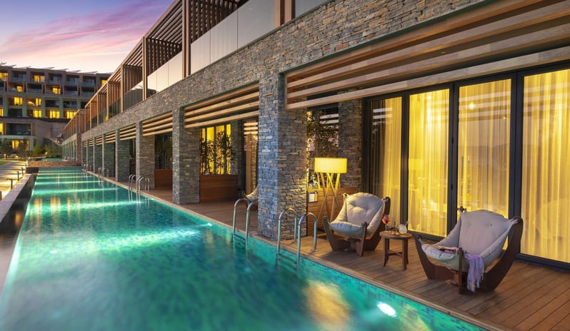 LUJO BODRUM LAGUNA DELUXE ROOM SEA VIEW POOL AT NIGHT